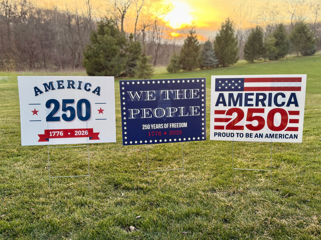 America 250, We The People, Proud to be American yard sign in lawn at sunset